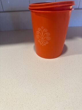 Tupperware Orange Storage Cup with White Floral Motif vintage